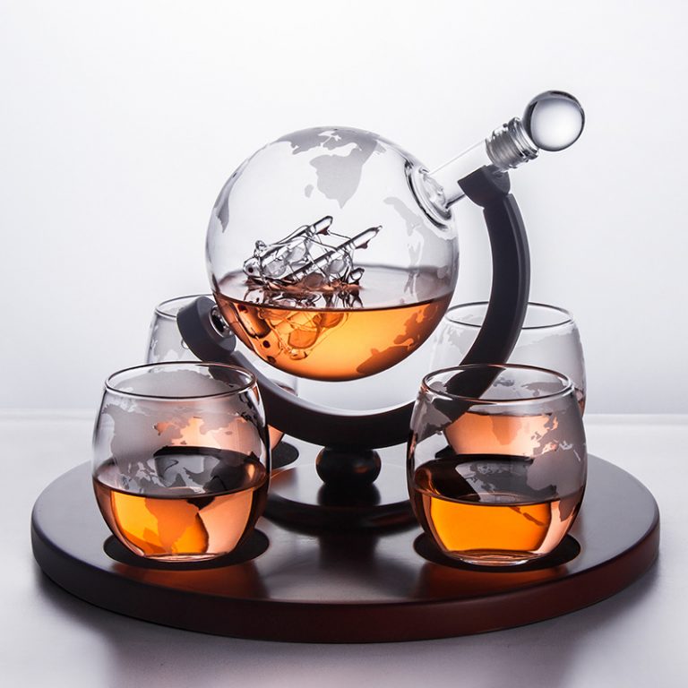 Glass globe decanter on display stand
