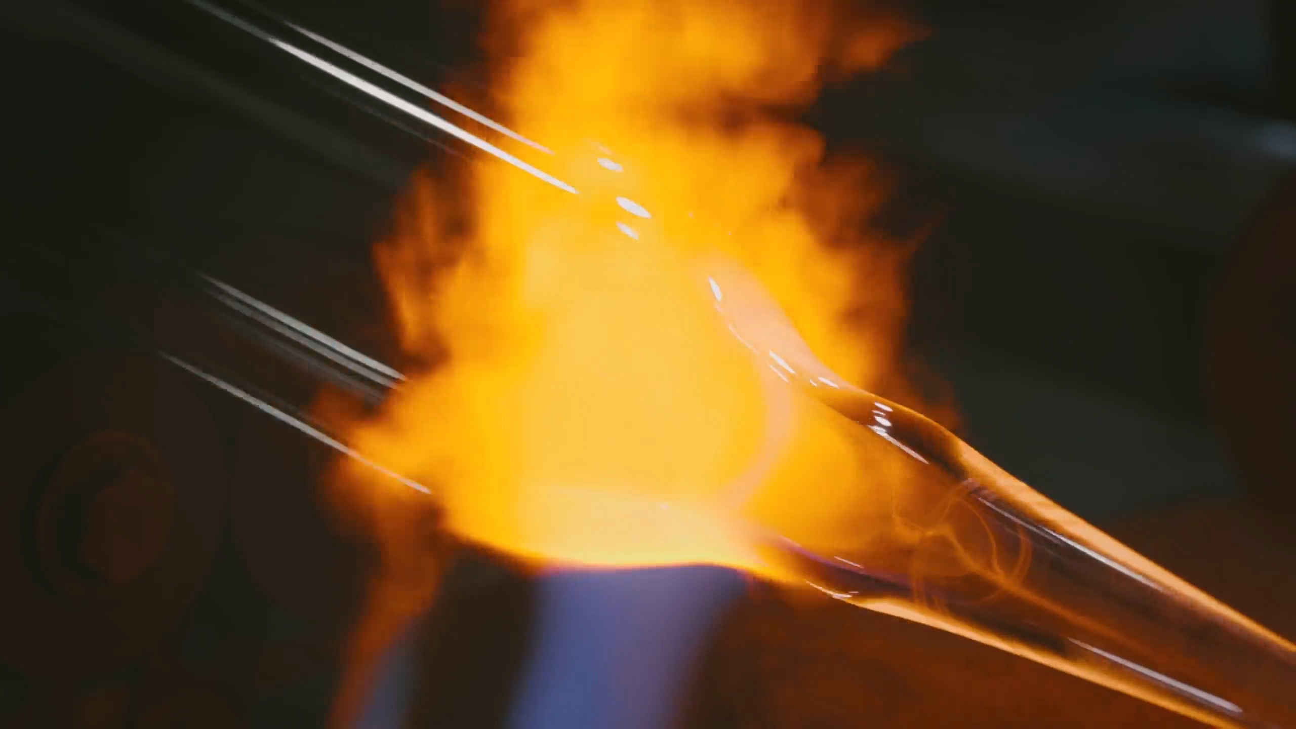 Borosilicate glass tube being shaped over a workshop flame