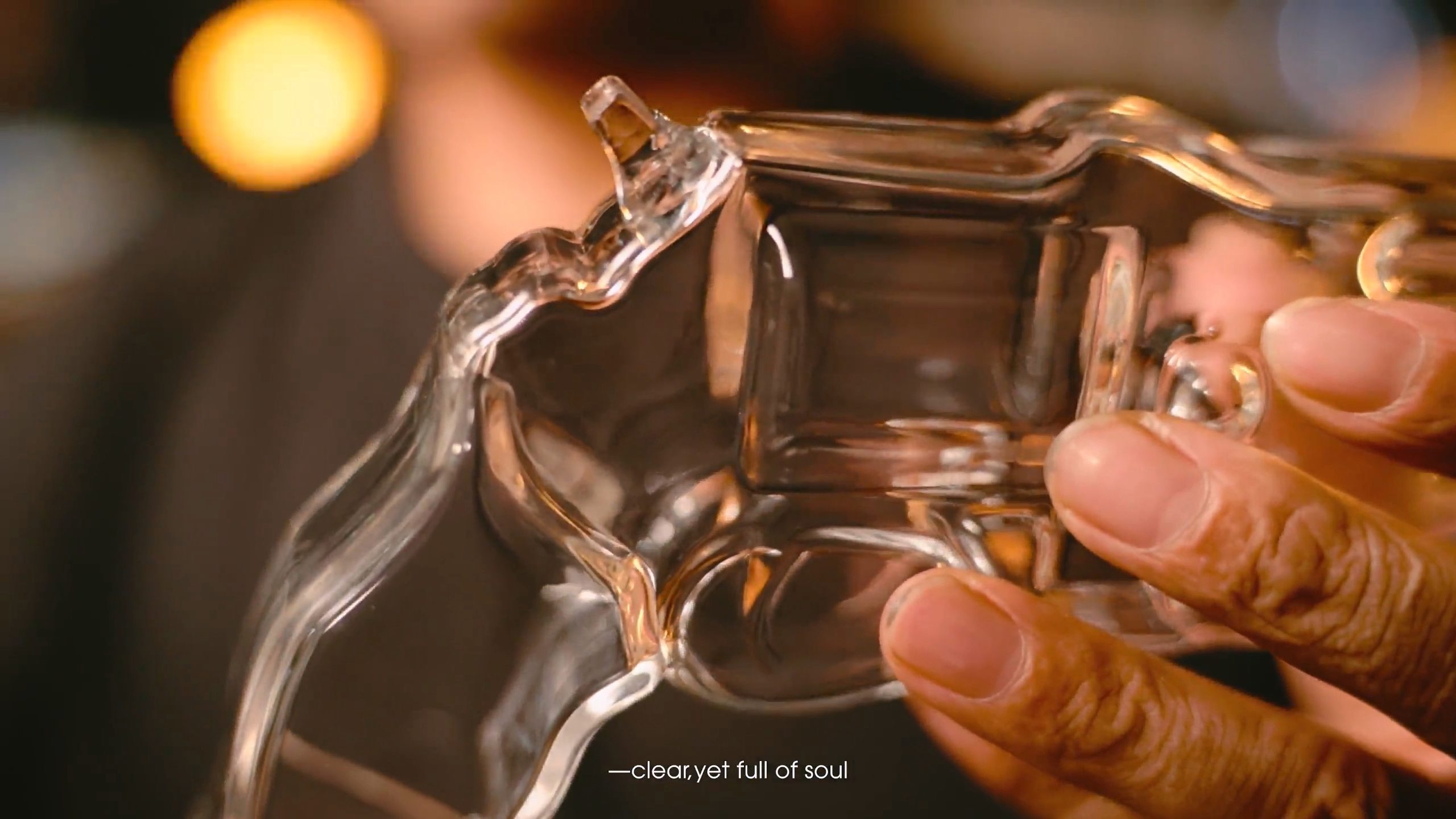 Glass being heated and formed by flame