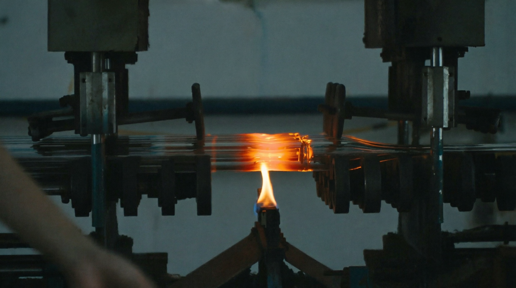 Borosilicate glass components being formed on production equipment